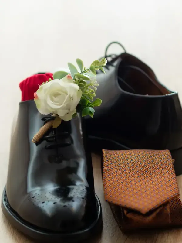 The groom's shoes and buttonhole
