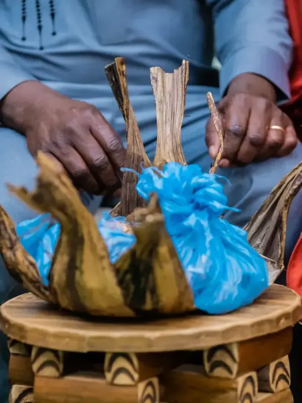 Hands around palm wine at a traditional marriage (dot)