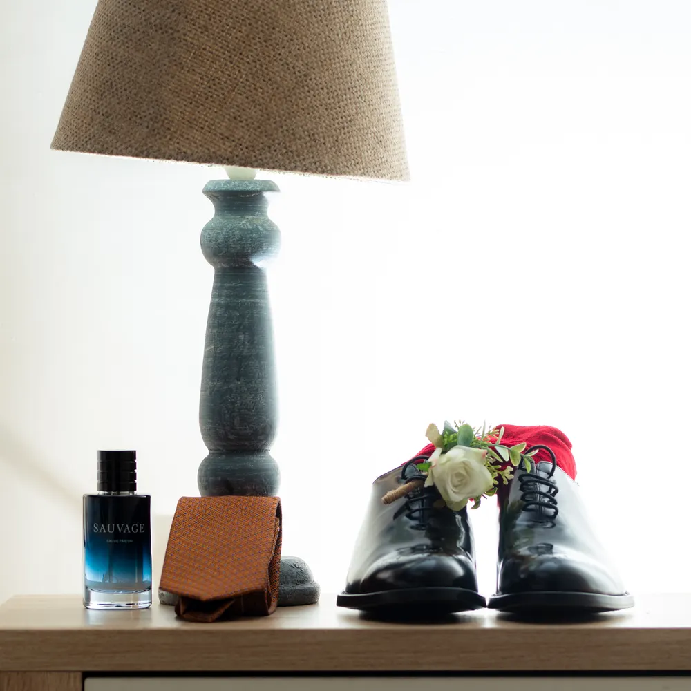 The groom's shoes, perfume and buttonhole, photograph by L21STUDIOS